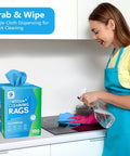 Front view of GLIMGLINT blue microfiber cleaning rags 100-pack box on a kitchen counter.