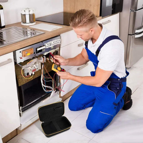 Technician using multimeter with hard carrying case for Fluke digital multimeters like 87V 88V Fifteen B Plus on floor