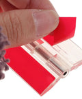 Close-up of Self Adhesive Clear Acrylic Flush Hinges Set Of 5 for cabinets and furniture, showing red adhesive strip removal detail.