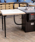 Knock Down Outfeed Table Kit With Foldable Legs For Small Shops attached to table saw in workshop