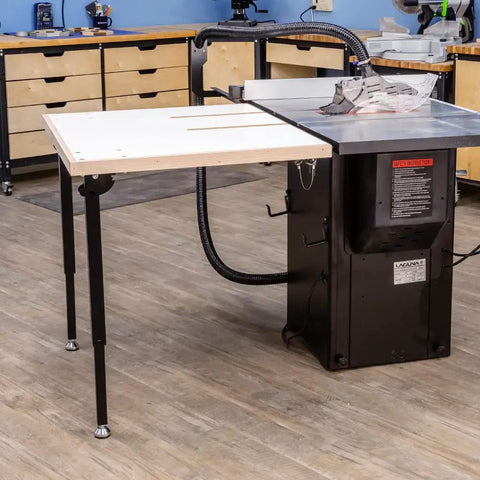 Knock Down Outfeed Table Kit With Foldable Legs For Small Shops attached to table saw in workshop