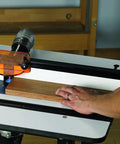 Image of a Heavy Duty Solid Phenolic Router Table Top With A Slick Ultra Flat Surface and T profile slot being used.