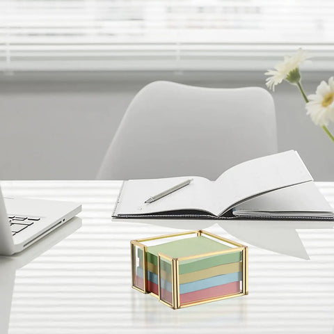 Gold Trimmed Glass Sticky Note Holder With Non Slip Pads For 3x3 Inch Notes on a modern office desk with laptop and notepad