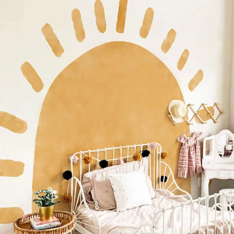 Large Fabric Watercolor Boho Half Sun Wall Decals Peel And Stick Pastel Sunrise Mural For Kids Baby Room Playroom Nursery Bedroom 94.49 Inches By 70.87 Inches Self Adhesive Arch Decor showing a pastel boho sun design above a bed in a nursery.