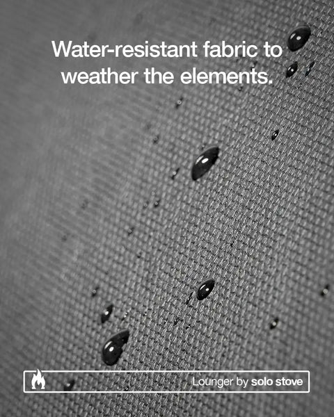 Water droplets on water-resistant fabric of Adjustable Chaise Lounge With 2 Inch Foam Pad And Portable Carry Case