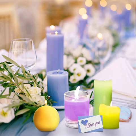 Table decorated with colorful candles and flowers, featuring the "All In One Candle Making Kit For Beginners With 2.12 Lb Soy Wax Dyes Wicks Stickers And More DIY Wax Melt Kit For Adults And Craft Lovers Super Easy To Use Budget Friendly Bang For Buck."