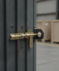 Rock Solid Slide Bolt Gate Latch Rust Proof Galvanized Steel Hardware With Tight Strike Plate For Outdoor Barn Shed Door Lockdown Guard And No Sweat Weather Shielding on a metal door.