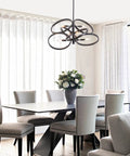 Contemporary 6-Light Hanging Chandelier in Matte Black and Brass Finish with Mid Century Geometric Pendant Design over dining table