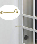 Gate Hook and Eye Latch with Screws Cabin for Sliding Window Barn Door, gold metal, shown attached to a door.