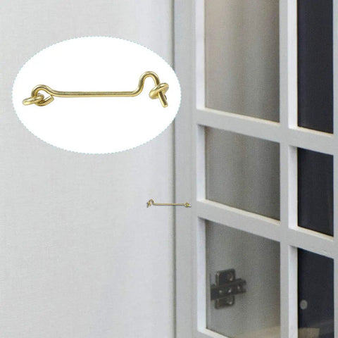Gate Hook and Eye Latch with Screws Cabin for Sliding Window Barn Door, gold metal, shown attached to a door.