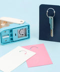 Versatile Hangtag Punch For DIY Jewelry Displays And Card Tags with cut cards, keychain display, ideal for scrapbooking, 80-500 GSM paper.