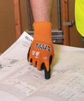 Rugged Knit Dipped Work Gloves With Nitrile Coating For Cut Resistance ANSI A1 Touchscreen Compatible, shown on hand, pointing at blueprint.