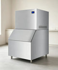 Heavy Duty Commercial Ice Maker Pumping Out Crisp Clear Cubes On The Fly With Stainless Steel Frame And Roomy Storage Bin.