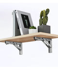 Heavy Duty Folding Shelf Brackets For Wall Mounted Console Tables Rust Resistant Stainless Steel under a wooden shelf with decor.