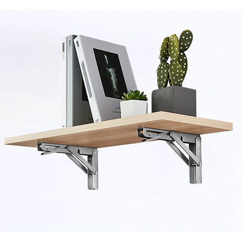Heavy Duty Folding Shelf Brackets For Wall Mounted Console Tables Rust Resistant Stainless Steel under a wooden shelf with decor.