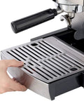 Close-up view of Professional Single Pump Semi Automatic Espresso Coffee Machine For Home Brew Barista Style Shots Stainless Steel Body 110 To 240V Easy Pull Espresso Durable Build Makes Rich Creamy Espresso Every Time, showing steel drip tray being adjusted.