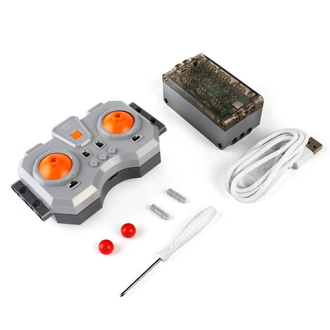Slick Hopped Up Power Module Kit with remote control unit, battery housing, and cables for building block models.