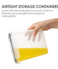 Hand holding airtight container with yellow liquid, showcasing 32-Piece Airtight Food Storage Containers Set BPA Free Plastic Canisters With Lids.