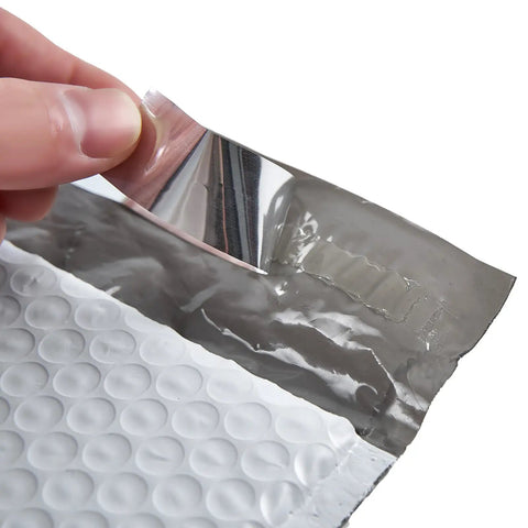 Close-up of self-seal adhesive strip on White Bubble Padded Poly Mailer Bags 9.5 X 13.5 Inches Self Seal Opaque Envelopes Tear Proof