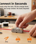 Hand using Double Wire Push In Terminal Connectors Kit No Fuss Fire Resistant Lever Lock Wire Connectors Tool Free Quick Connect