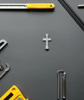 Mini Cross Socket Wrench Kit M2 M2.5 M3 For Rc Model Cars Hobby compact spanner on dark surface among tools.