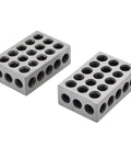 Two 1 by 2 by 3 inch hardened steel machinist setup blocks with 23 through-holes, front and side view.