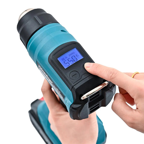 Person adjusting Pro Grade Cordless Heat Gun for 18V Battery Systems with Fast Heating Up To 1202F on digital display