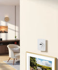 No Drill Wall Hooks Set Heavy Duty Adhesive Hangers For Kitchen Bathroom And Home Tool-Free Install Damage-Free Removal With Removable Non-Marking Tape Securely Hang Pics Without Scratching Walls. White adhesive hook mounted on wall for framed art