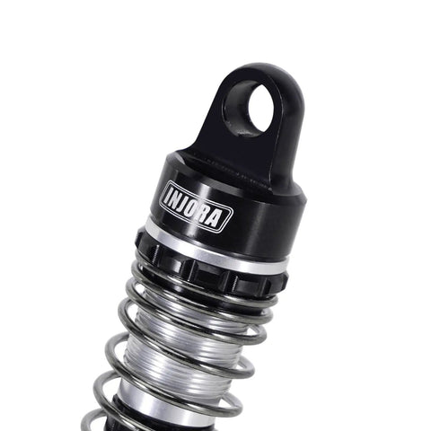 Close-up of 59mm Aluminum Oil Shock with Adjustable Damping featuring CNC machined aluminum and threaded shock body.