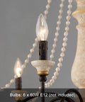 Close-up of bulb sockets and wood bead accents on French Country Farmhouse Six Light Chandelier, distressed white wood finish.