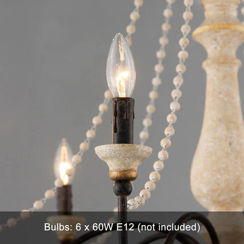 Close-up of bulb sockets and wood bead accents on French Country Farmhouse Six Light Chandelier, distressed white wood finish.