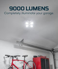 High Bright 9000 Lumen Garage Light With Adjustable Panels illuminating a garage interior, showing light impact on ceiling and bicycle.