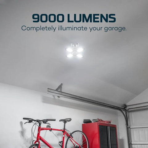 High Bright 9000 Lumen Garage Light With Adjustable Panels illuminating a garage interior, showing light impact on ceiling and bicycle.