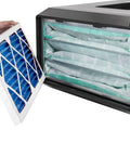 Hand inserting 24x12x1 Electrostatic Outer Air Filter For AFS-1000B And AFS-1000C into HVAC system, blue nonwoven media visible