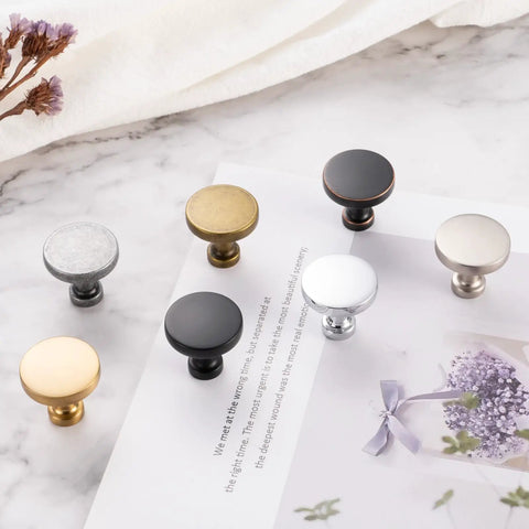 Top Shelf Round Oil Rubbed Bronze Cabinet Knobs 1 1/4 Inch Built Tough Rust Resistant Kitchen Hardware 30 Pack Including Mounting Screws displayed on white surface.