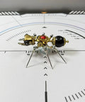 Mechanical Ant 3D Metal Model Kit with 130 Plus Pieces, Steampunk DIY Build for Adults and Teens, Creative Desk Display, Dope Gift for Engineers, Hobbyists, and Collectors. small brass ant model on a calibration mat