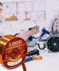 Engineer working with 20 AWG Magnet Wire Enamel Copper for Transformers and Motors, 8 Oz 157 Ft, in an electrical workshop