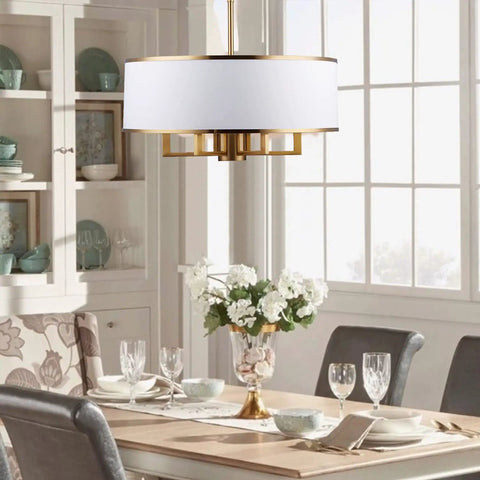 Dining room with Black Drum Chandelier With Adjustable Chain Link, 19-Inch, 5 Lights, White Fabric Shade over table.