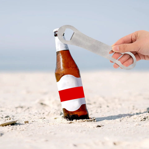 Two Pack V Rod Bottle Opener Set For Bartenders And Home Bar opening a bottle on a sandy beach