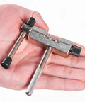 Bike Chain Breaker Remover Tool for Easy Chain Removal, stainless steel, compact size, held in hand, black and silver