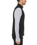 Heavy Duty Kick Ass 100 Percent Merino Wool Men Vest Expedition Grade Heavyweight Three Season Insulated Thermal Mid Layer Machine Washable Moisture Wicking Black side view on model.