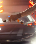 Person using Four Piece Lever Blow Gun Set With Rubber Tip Nozzles And Safety Tips, Pro Grade Quarter Inch NPT Inlet Air Tool on car