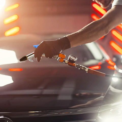 Person using Four Piece Lever Blow Gun Set With Rubber Tip Nozzles And Safety Tips, Pro Grade Quarter Inch NPT Inlet Air Tool on car