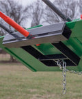 Close-up of Hay Bale Spear Frame Attachment For Universal Front Loader Buckets, highlighting heavy-duty steel and chain detail.