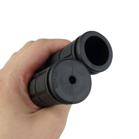 Hand holding 2 Pairs Mushroom Bicycle Handlebar Grips For BMX MTB Road And Mountain Bikes Soft Rubber Comfort 120Mm Length Black