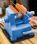 Set Of Two Pair Four Inch Soft Jaw Pads For Bench Vise With Knockout Magnetic Base attached to a blue bench vise holding a metal rod.