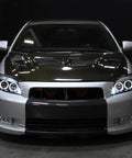 Front view of car with 2005 To 2010 Scion tC LED Halo Projector Headlights Upgrade Kit With Black Housing And Angel Eye Rings