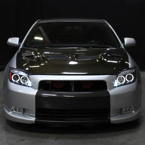 Front view of car with 2005 To 2010 Scion tC LED Halo Projector Headlights Upgrade Kit With Black Housing And Angel Eye Rings
