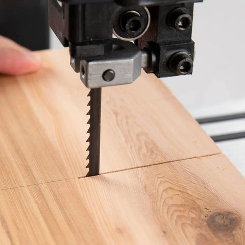 Close-up of wood cutting with three piece 93-1/2 inch wood bandsaw blades set for fourteen inch saws includes half inch 6TPI blade