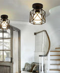 Dope Industrial Semi Flush Mount Ceiling Light Featuring A Sick Black Cage Design And Rustic Vintage Vibe illuminating entryway.